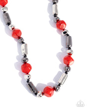 Load image into Gallery viewer, Necklace with red and silver beads on a white background