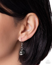 Load image into Gallery viewer, Close-up of an ear wearing a silver earring with a black bead.