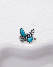 Load image into Gallery viewer, Butterfly-shaped ring with turquoise wings and silver accents on a white background